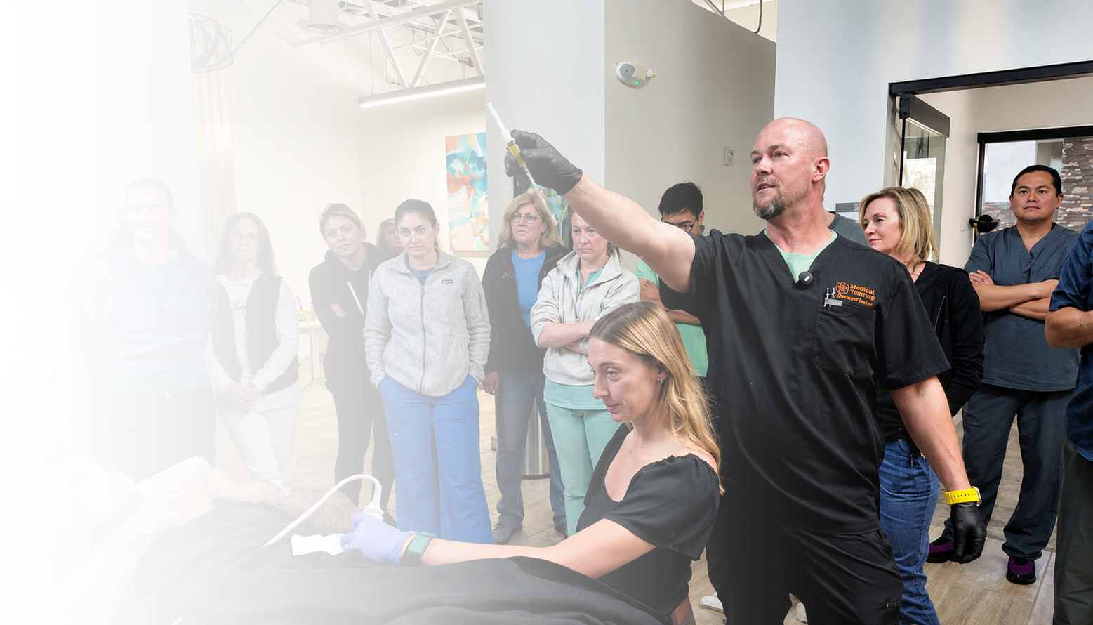 Trainees observing live procedure